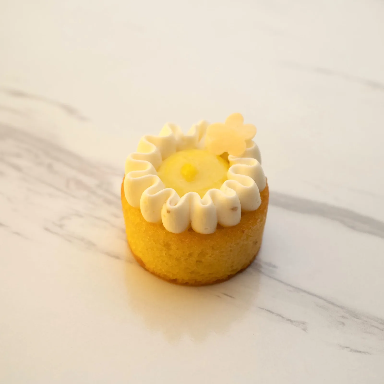 EASY PEASY LEMON YUZU (GF) — Moist almond-lemon cake, tangy lemon-yuzu custard and light Chantilly cream. Fresh, creamy and just the right amount of sharp. Meet your new Main Squeeze.